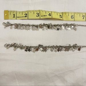 A set of silver colored steel ankelets/bracelets